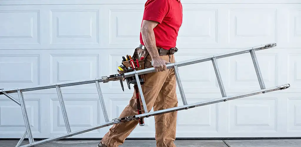 Garage door repair technician arriving with tools and ladder in Providence, RI