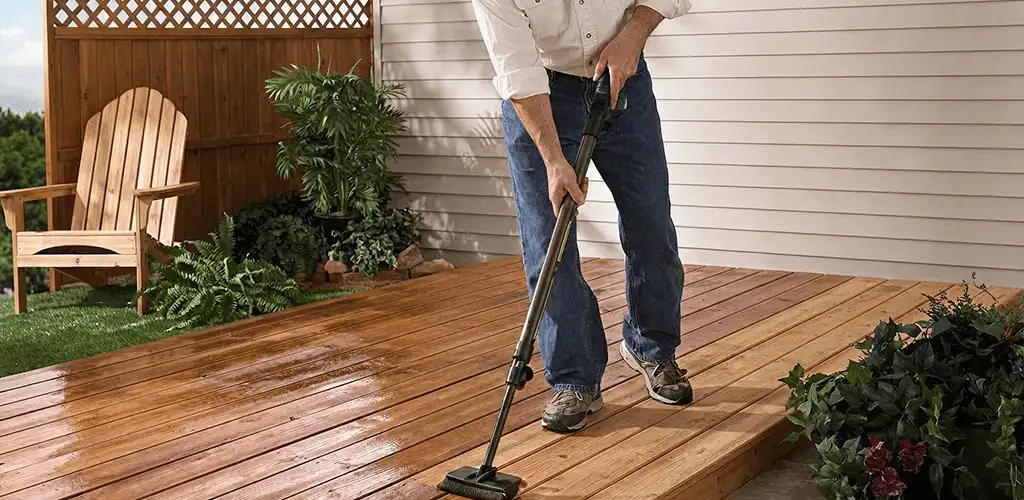 Deck staining service applying stain to a backyard wood deck in Providence, RI